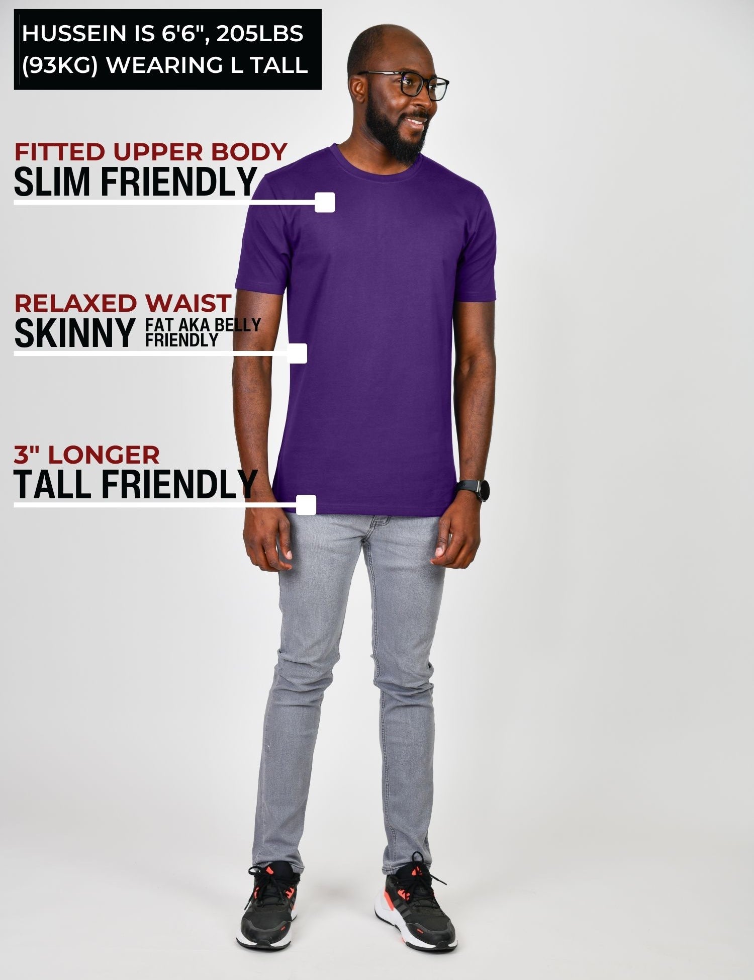 A head to toe shot of a tall slim guy in a studio and wearing a royal purple large tall slim t-shirt.
