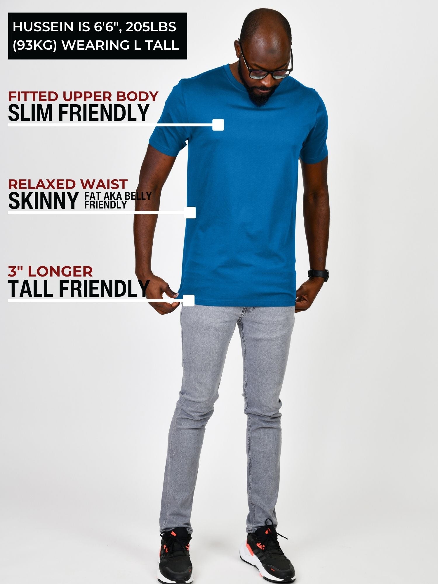 A head to toe shot in a studio of a tall and athletic guy wearing an azure large tall slim t-shirt.