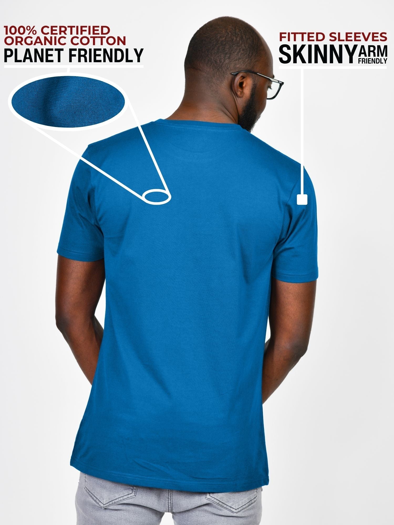 A shot from behind of a tall and slim guy in a studio and wearing an azure large tall slim t-shirt.