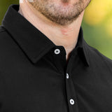 A close up of a stay-flat black tall polo collar.