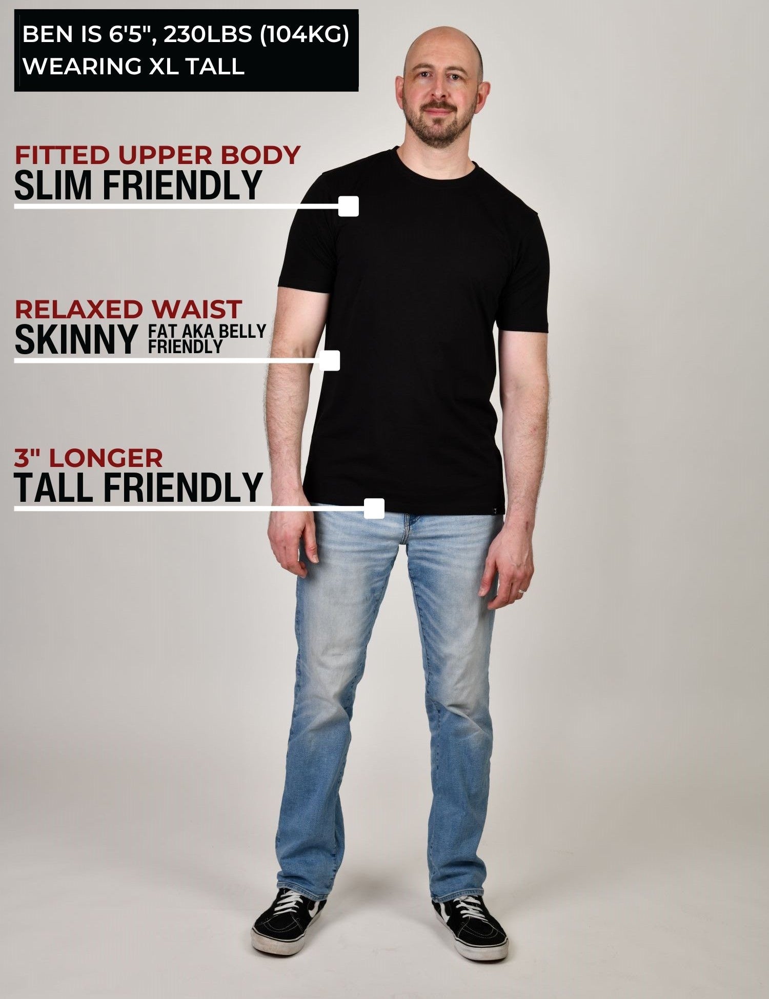 A head to toe shot of a tall muscular guy  in a studio and wearing a black XL tall t-shirt.