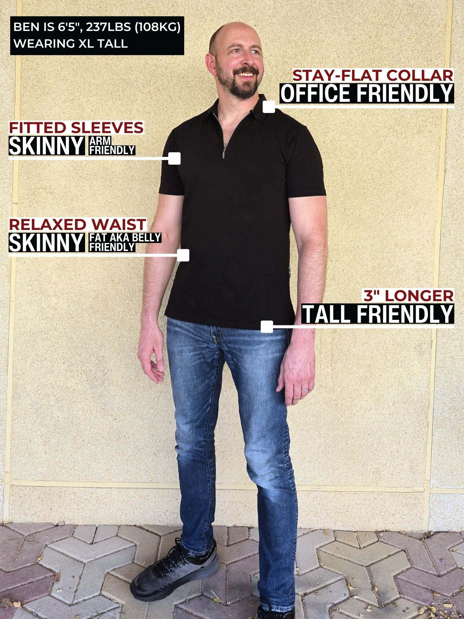 A head to toe shot of a tall slim guy wearing an XL tall black zip polo shirt.