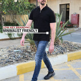 A tall slim man wearing an XL tall black zip polo shirt and walking in a residential compound.