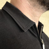 A close up Just Tall's stay-flat collar on their tall zip polo shirt.