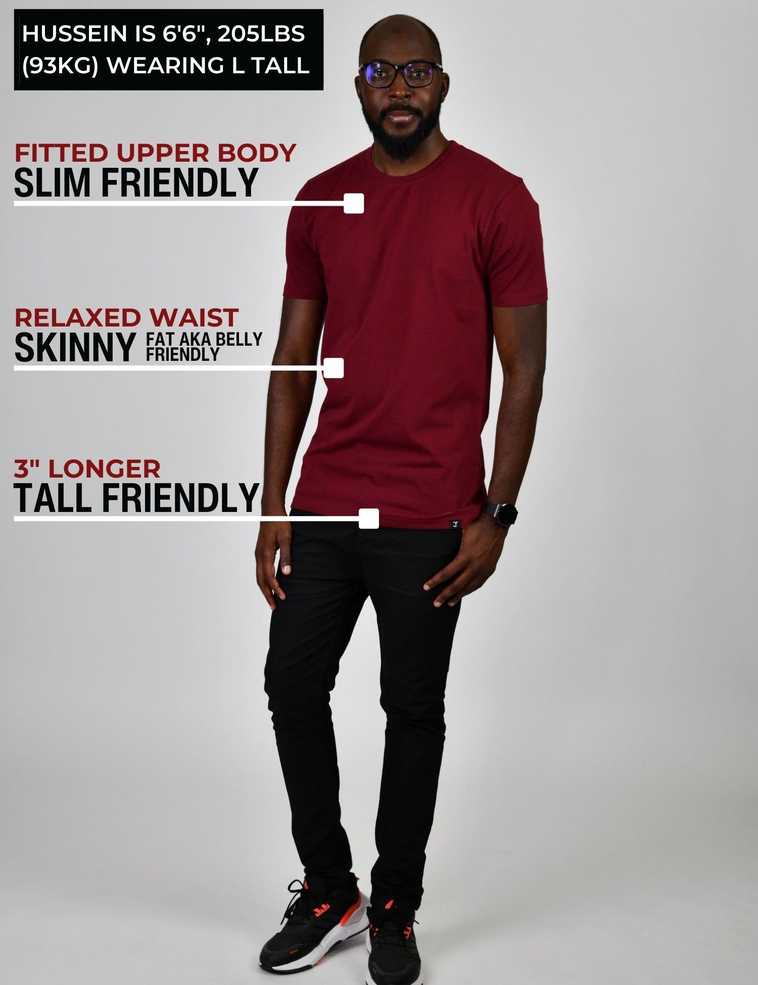 A head to toe shot of a tall slim guy  in a studio and wearing a cabernet large tall slim t-shirt.