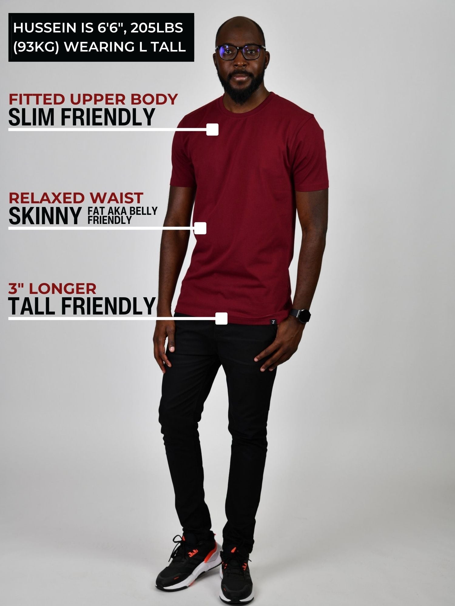 A head to toe shot of a tall slim guy in a studio and wearing a cabernet large tall slim t-shirt.