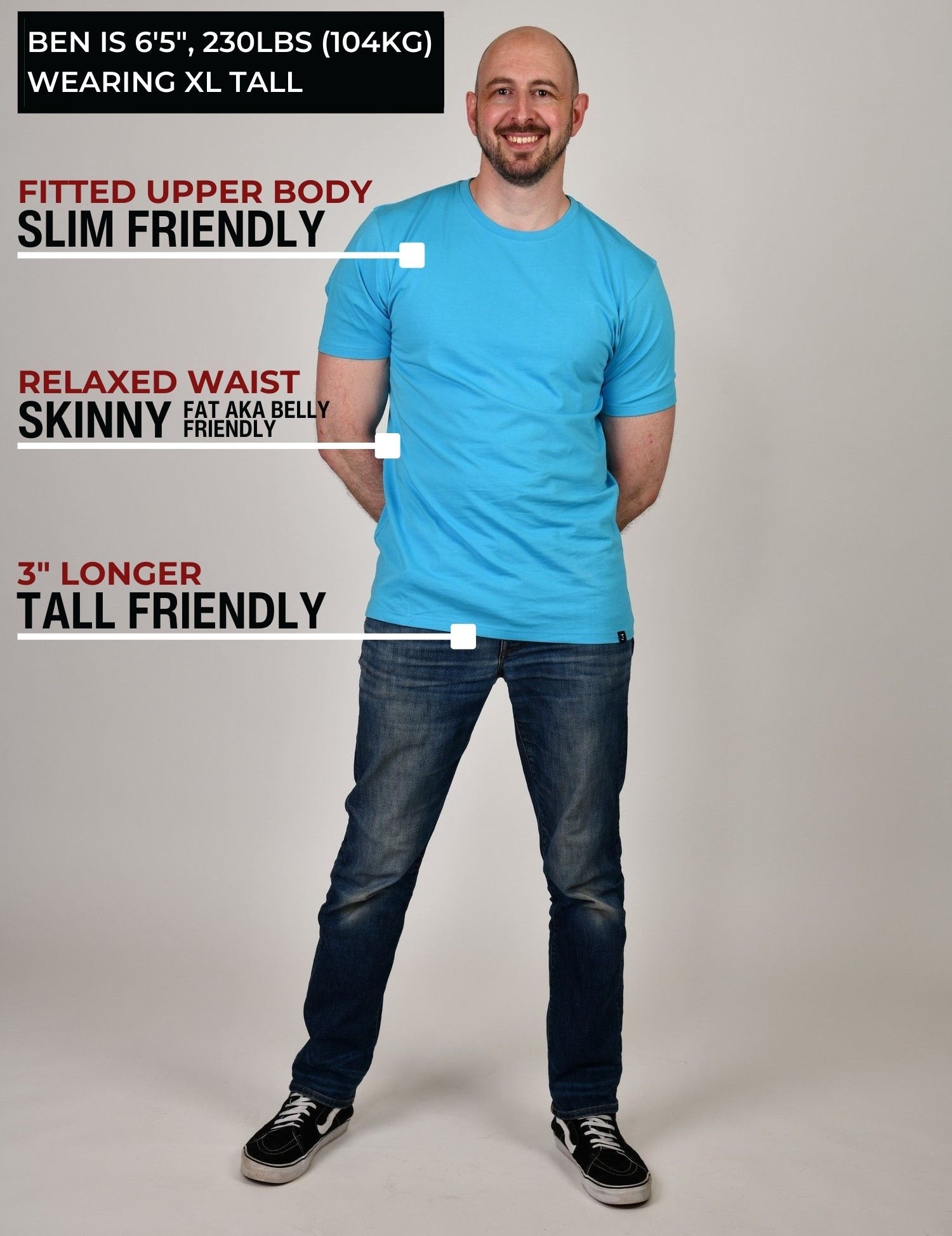 A head to toe shot of a tall slim guy in a studio and wearing a cyan XL tall slim t-shirt.