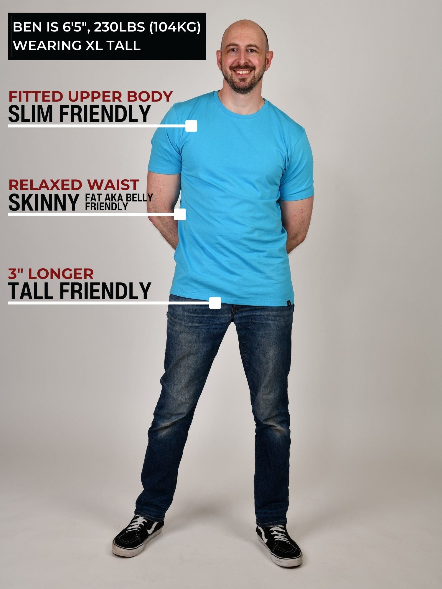 A head to toe shot of a tall slim guy in a studio and wearing a cyan XL tall slim t-shirt.