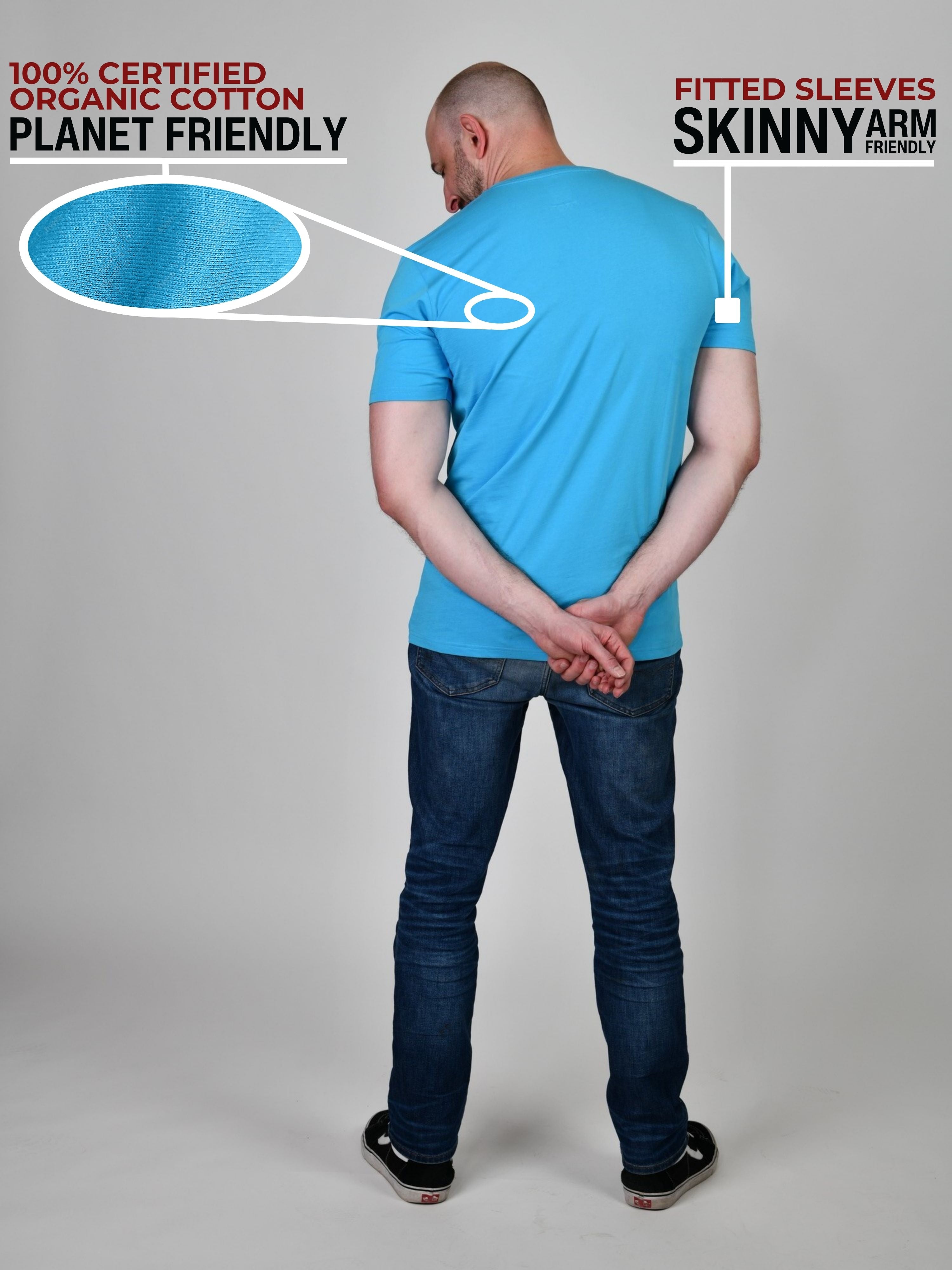 A shot from behind of a tall and athletic guy in a studio and wearing a cyan XL tall slim t-shirt.