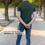 A shot from behind of a tall athletic guy in a park and wearing an XL tall slim dark pine polo shirt and showing the minimal Just Tall flag logo near the bottom of the side seam.