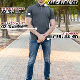 A head to toe shot of a tall athletic man in a park wearing a dark slate XL tall polo shirt and smiling.