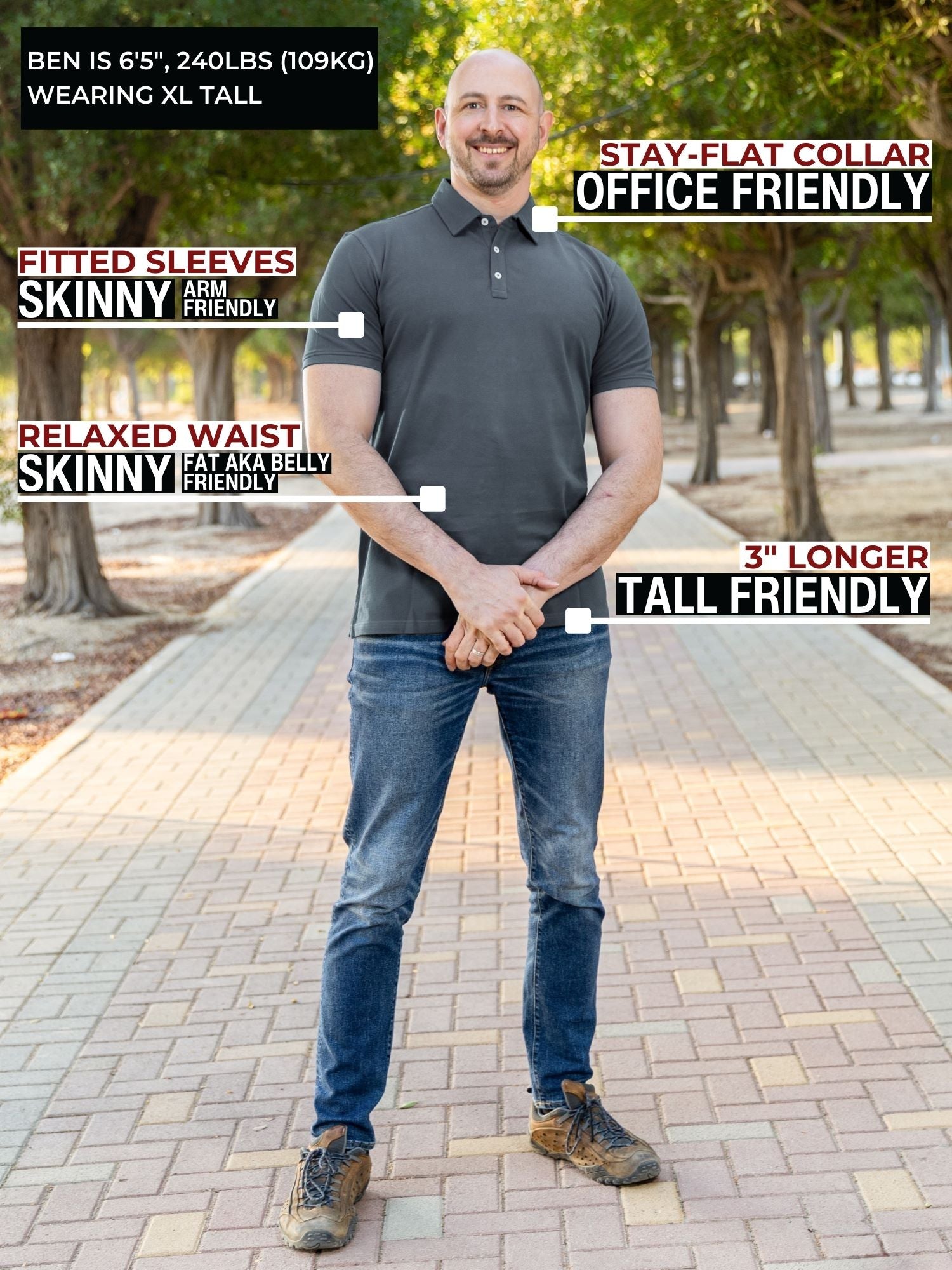 A head to toe shot of a tall athletic man in a park wearing a dark slate XL tall polo shirt and smiling.