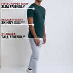 A head to toe shot of a tall slim guy  in a studio and wearing a dark teal medium tall slim t-shirt.