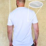 A shot from behind of a tall slim man wearing an XL tall heavyweight white t-shirt.