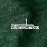 A close up of the dark green 100% organic cotton fabric.