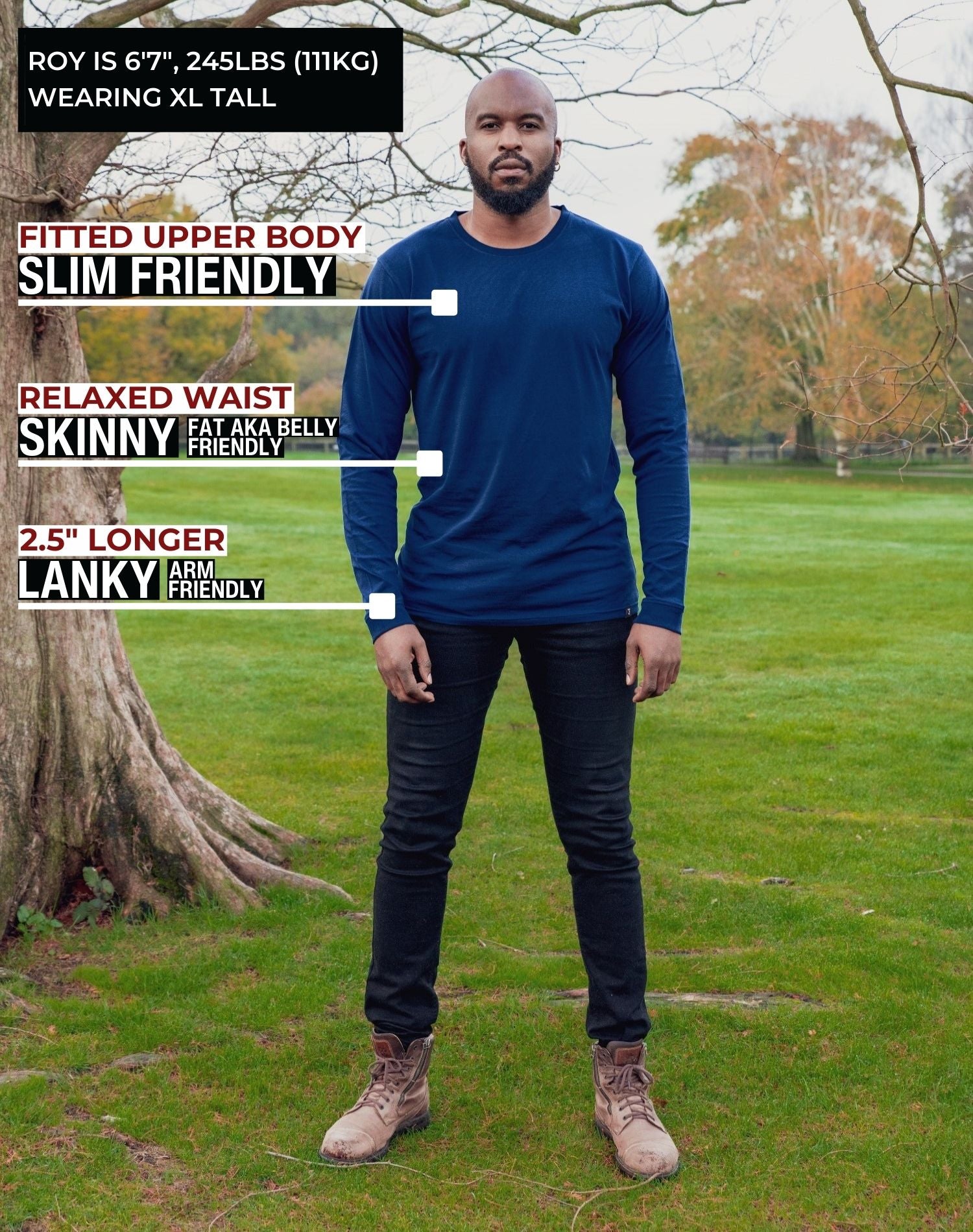 A head to toe shot of a tall athletic guy in a park wearing a navy long sleeve tall t-shirt.