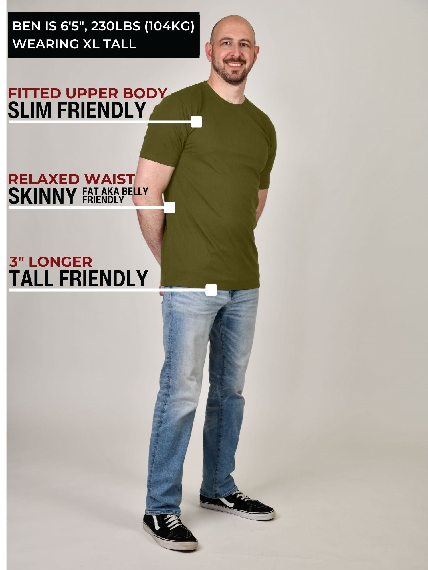 A head to toe shot of a tall muscular guy in a studio and wearing an olive XL tall t-shirt.
