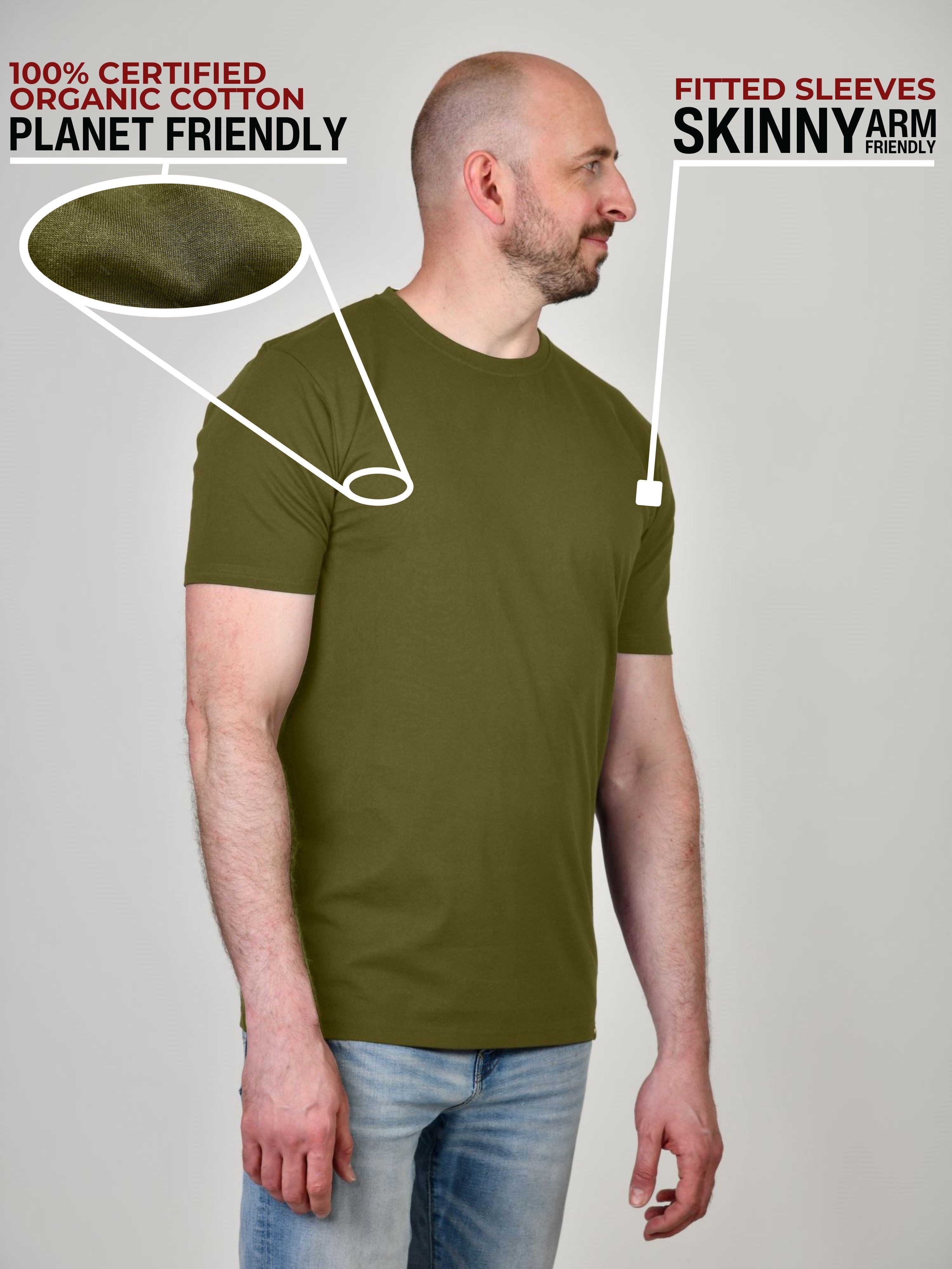 A side shot of a tall and slim guy in a studio and wearing an olive XL tall slim t-shirt.