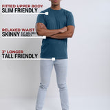 A head to toe shot of a tall slim guy in a studio and wearing a petrol medium tall slim t-shirt, arms folded.