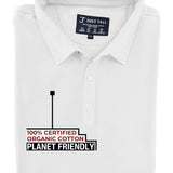 A close-up shot of a folded white tall slim polo, 100% certified organic cotton.