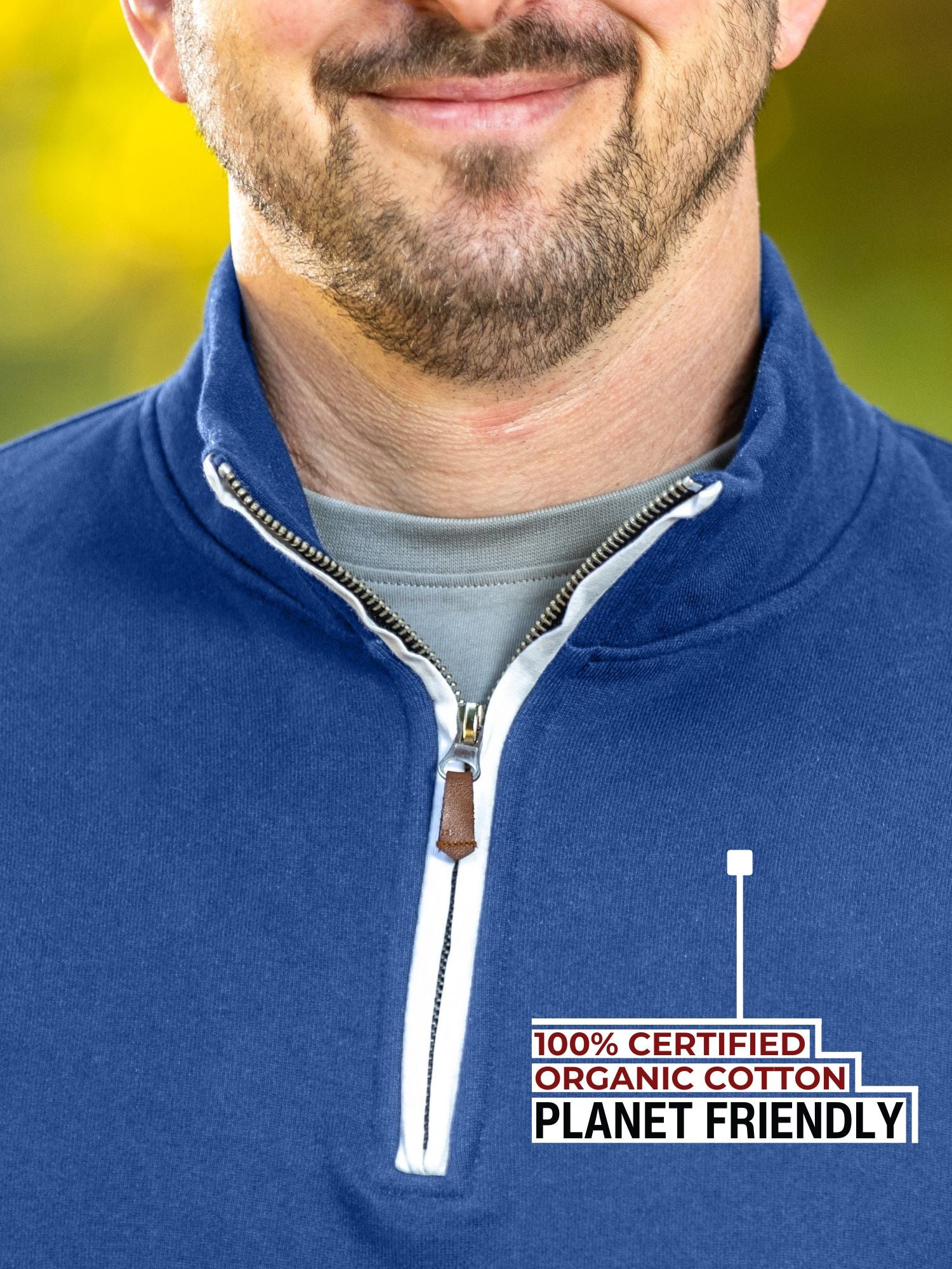 A close-up of the tall cobalt quarter zip collar and the durable metal zipper.