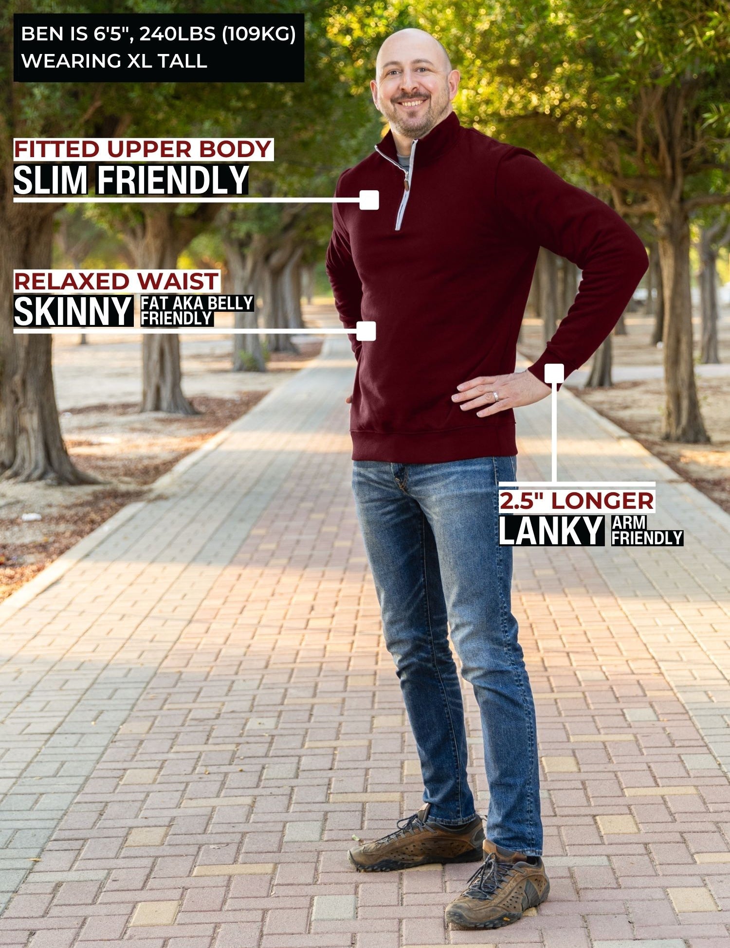 A head to toe shot of a tall athletic guy in a park wearing an XL tall extra long maroon quarter zip sweatshirt.