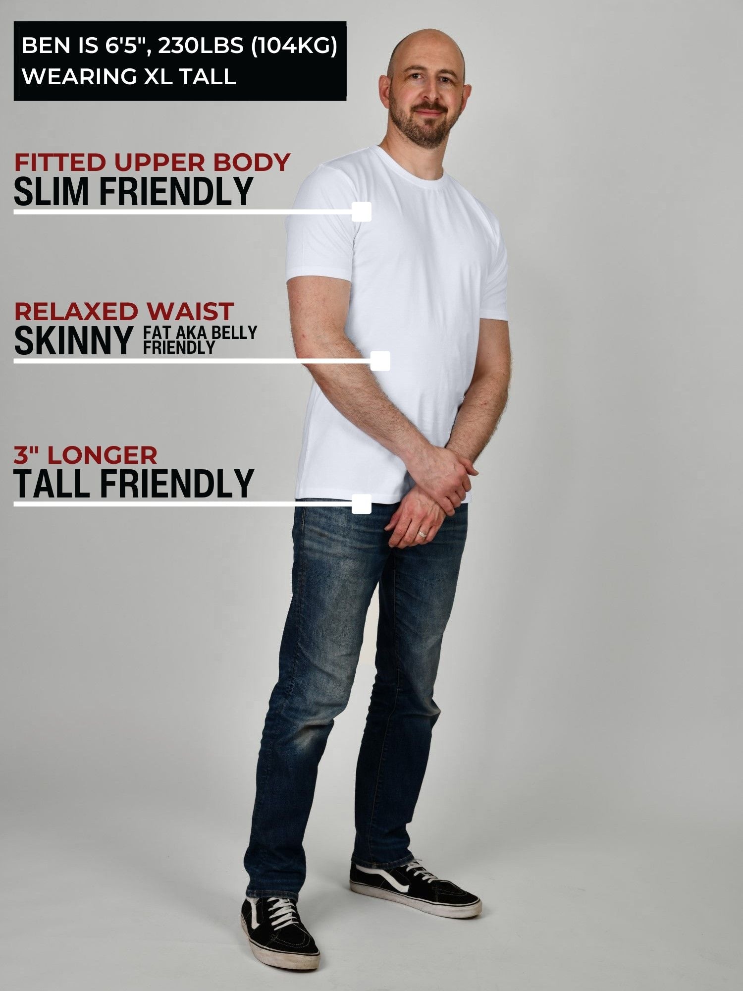 A head to toe shot of a tall muscular guy in a studio and wearing a white XL tall t-shirt.