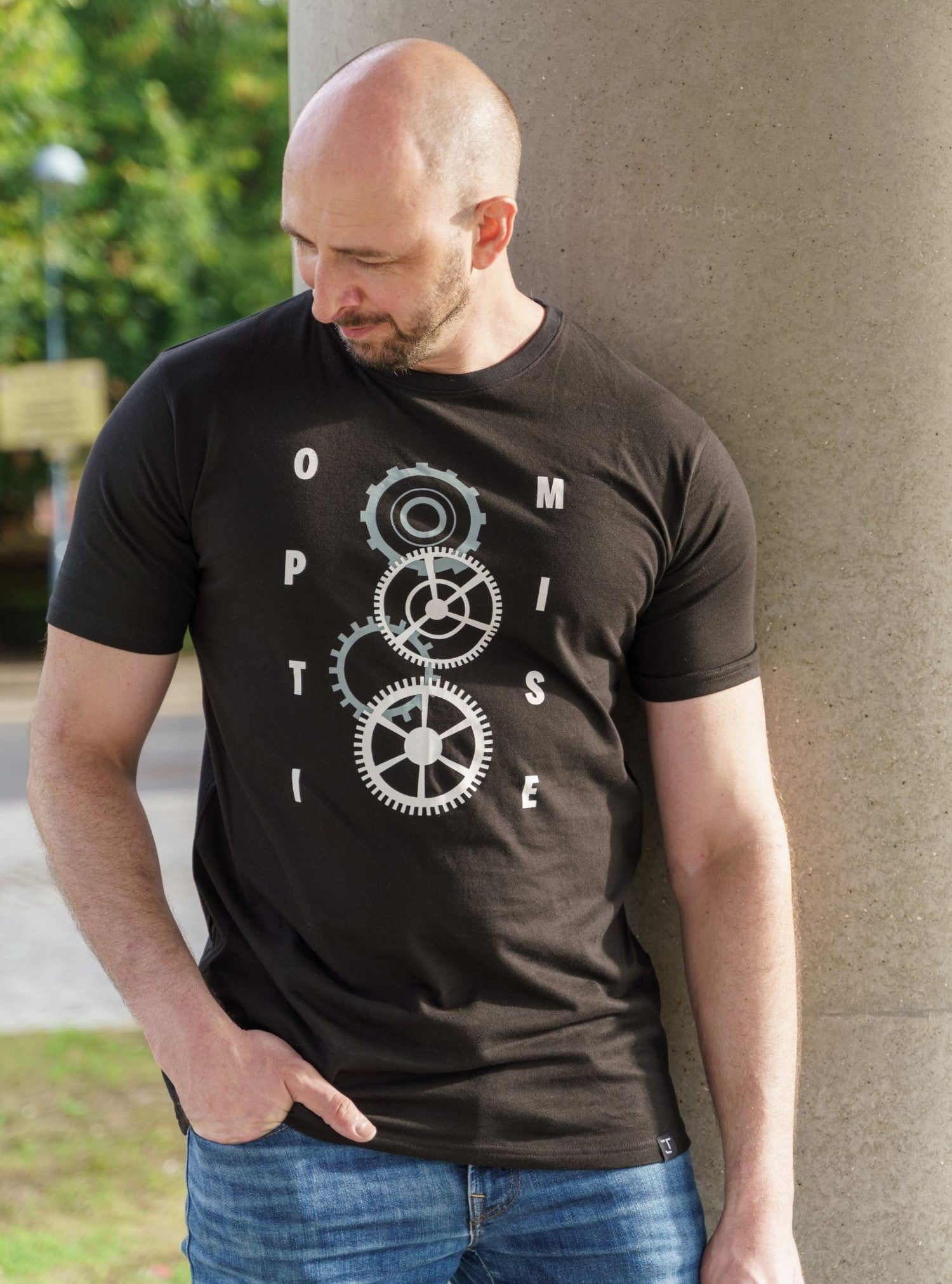 A tall slim guy wearing a tall slim graphic t-shirt.
