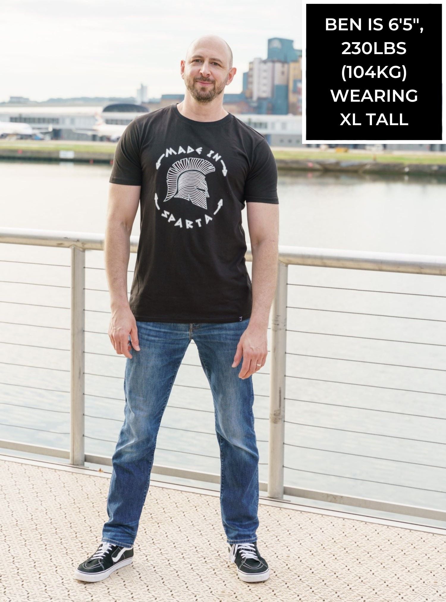 A tall skinny guy wearing a sparta tall slim t-shirt