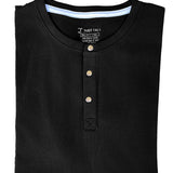A close up of a tall black short sleeve henley shirt.