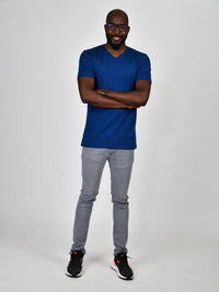 Thumbnail for A head to toe shot of a tall and slim guy in the studio wearing a navy blue L tall slim v-neck t-shirt.