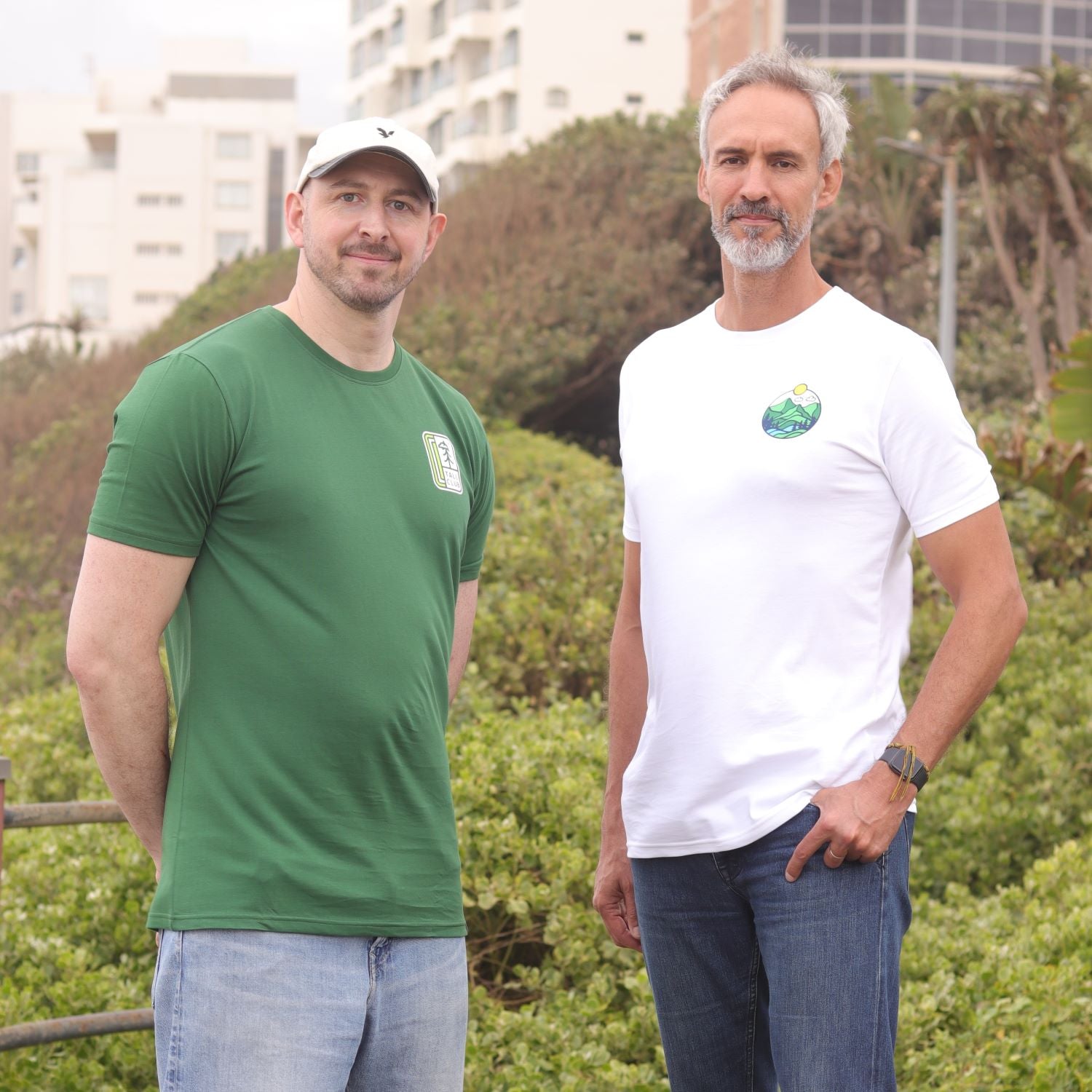 Two tall skinny guys wearing tall graphic tees.