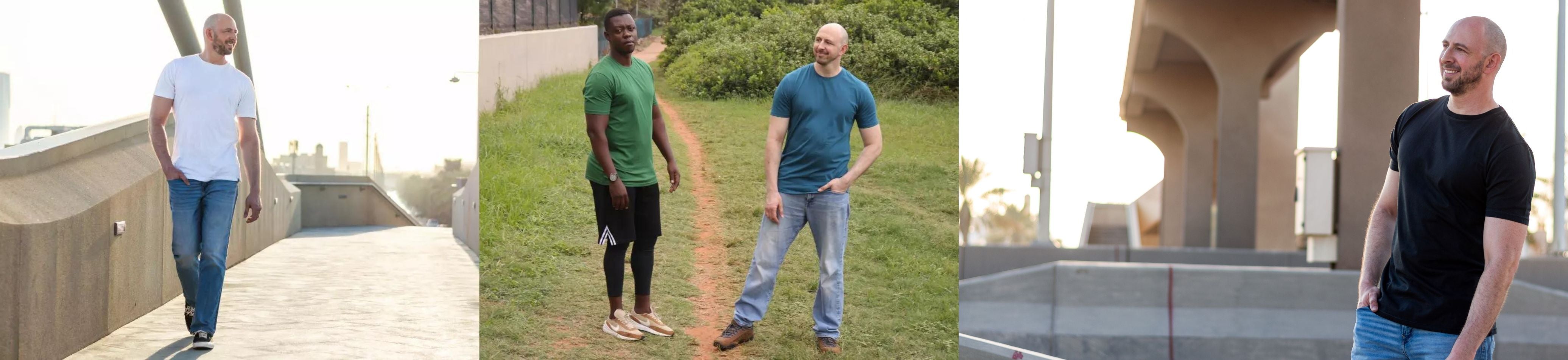 Tall slim guys on a bridge, in a park and under a bridge wearing white, green, petrol and black XL tall t-shirts.