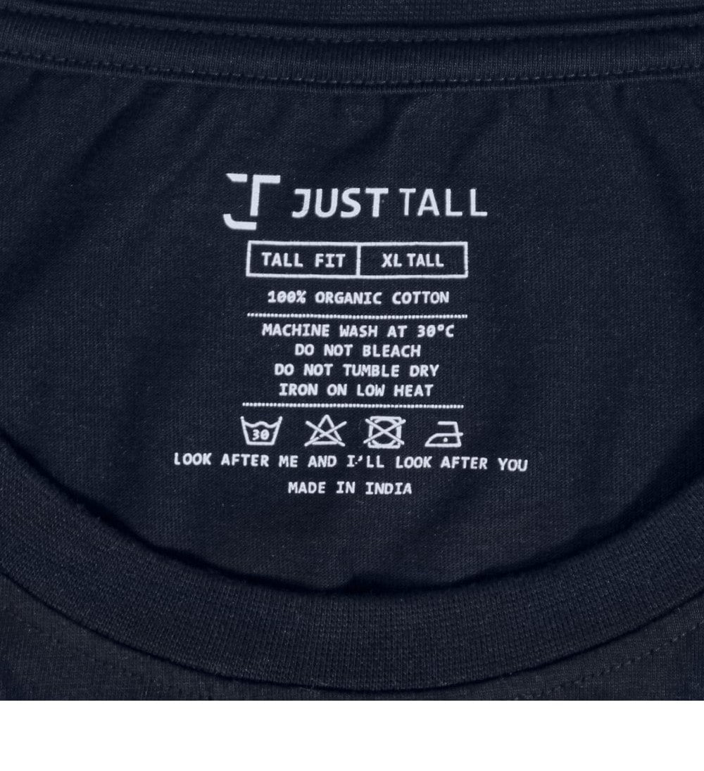 A close up of a printed Just Tall neck label detailing the size and care instructions.