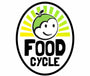Logo of Food Cycle with a smiling face and green apple on a white background