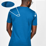 A shot from behind of a tall and slim guy in a studio and wearing an azure large tall slim t-shirt.