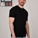 A tall and slim man in the studio standing in front of a light background. The smiling model is wearing an extra long slim black t-shirt in a size XL. The tall black t-shirt features a 3" longer body, 100% organic cotton, and is soft & preshrunk. The black t-shirt is ideal for tall slim men 6'2"+. Buy 2 Save 10%, Buy 4 Save 15%, Buy 6 Save 20%.