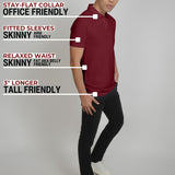 A head to toe shot of a tall slim man standing in a studio and wearing a maroon medium tall polo shirt.