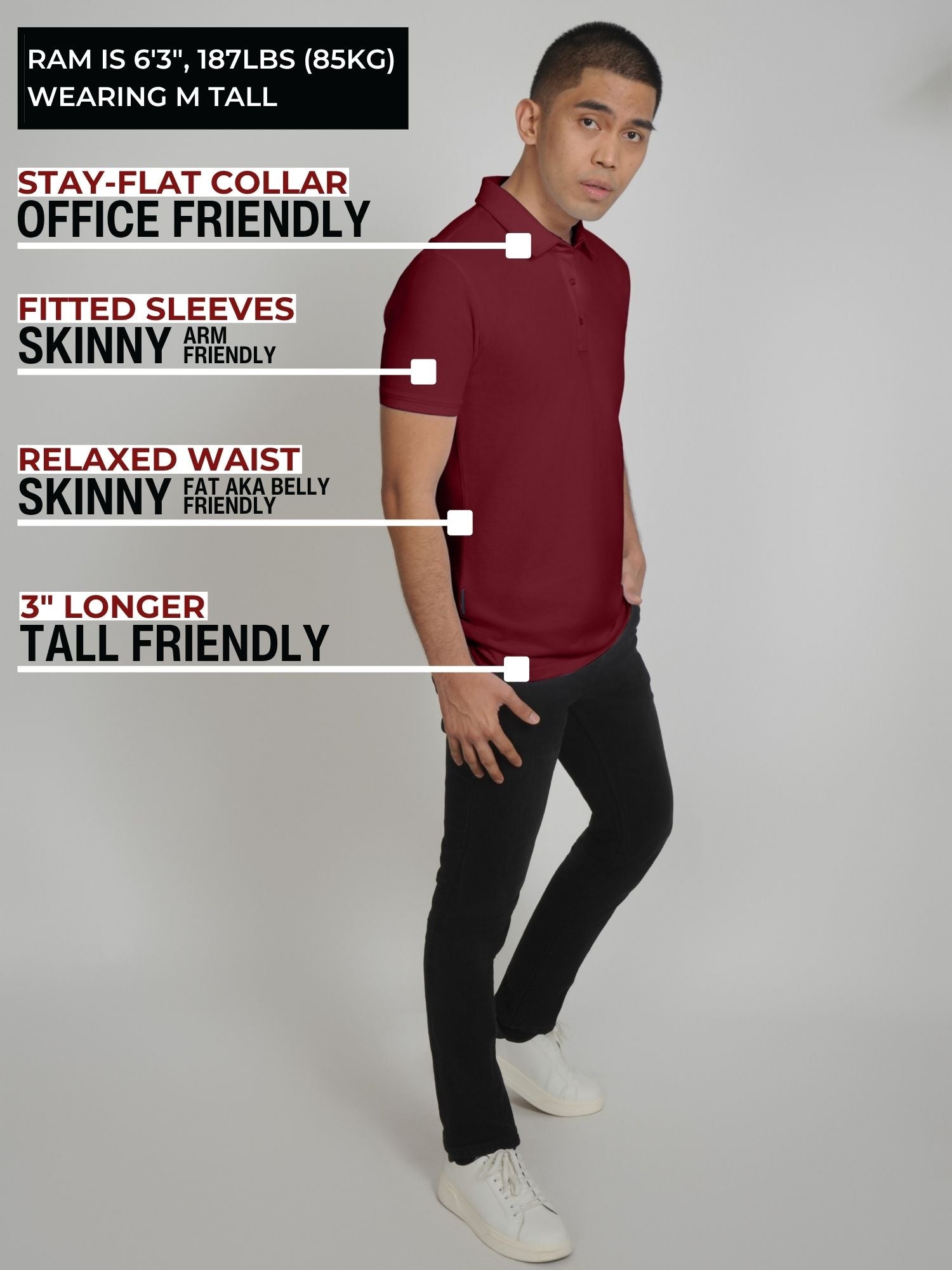 A head to toe shot of a tall slim man standing in a studio and wearing a maroon medium tall polo shirt.