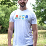 An upper body shot of a tall slim guy in a park wearing an XL tall and slim fitting graphic t-shirt in white.