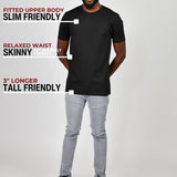 A head to toe shot of a tall slim guy wearing a large tall heavyweight black t-shirt.