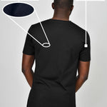 A shot from behind of a tall slim guy wearing a black heavyweight XL tall t-shirt.