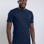 A tall slim man wearing an large tall heavyweight midnight blue t-shirt.