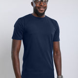 A tall slim man wearing an large tall heavyweight midnight blue t-shirt.