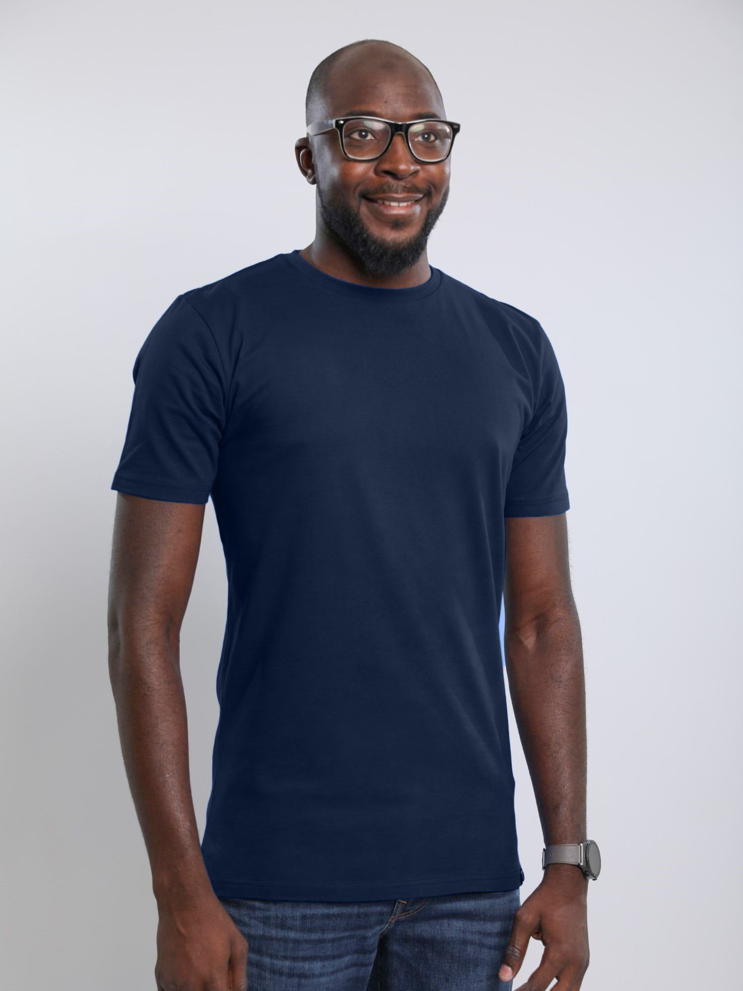 A tall slim man wearing an large tall heavyweight midnight blue t-shirt.