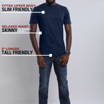 A head to toe shot of a tall slim guy wearing a large tall midnight blue heavyweight t-shirt.