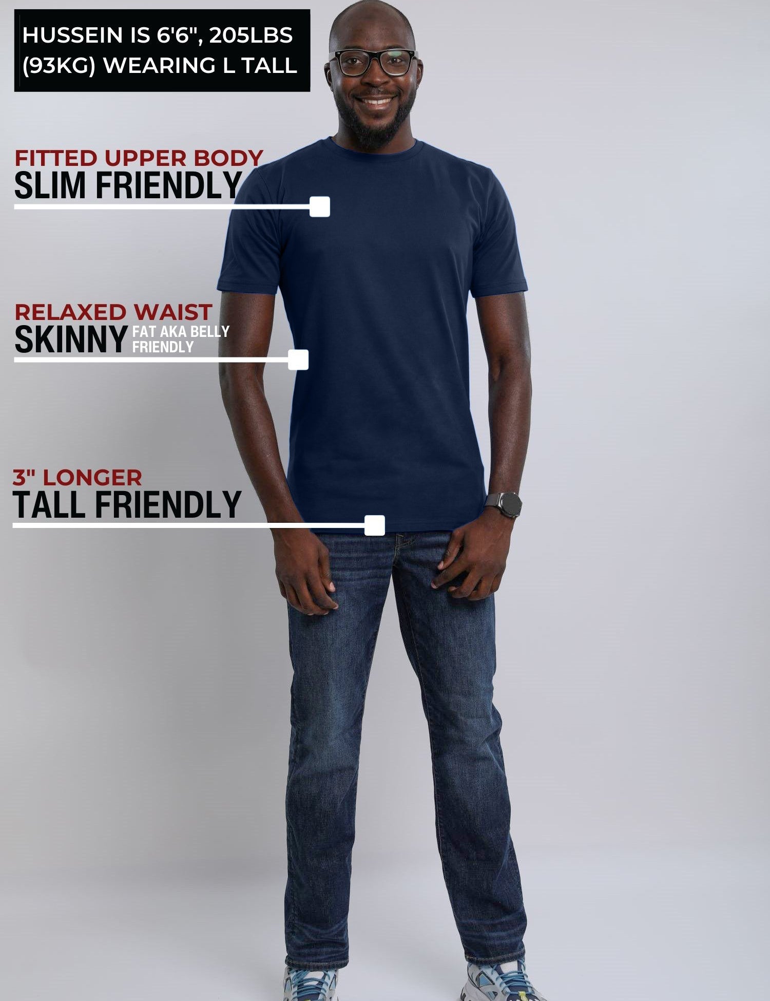 A head to toe shot of a tall slim guy wearing a large tall midnight blue heavyweight t-shirt.