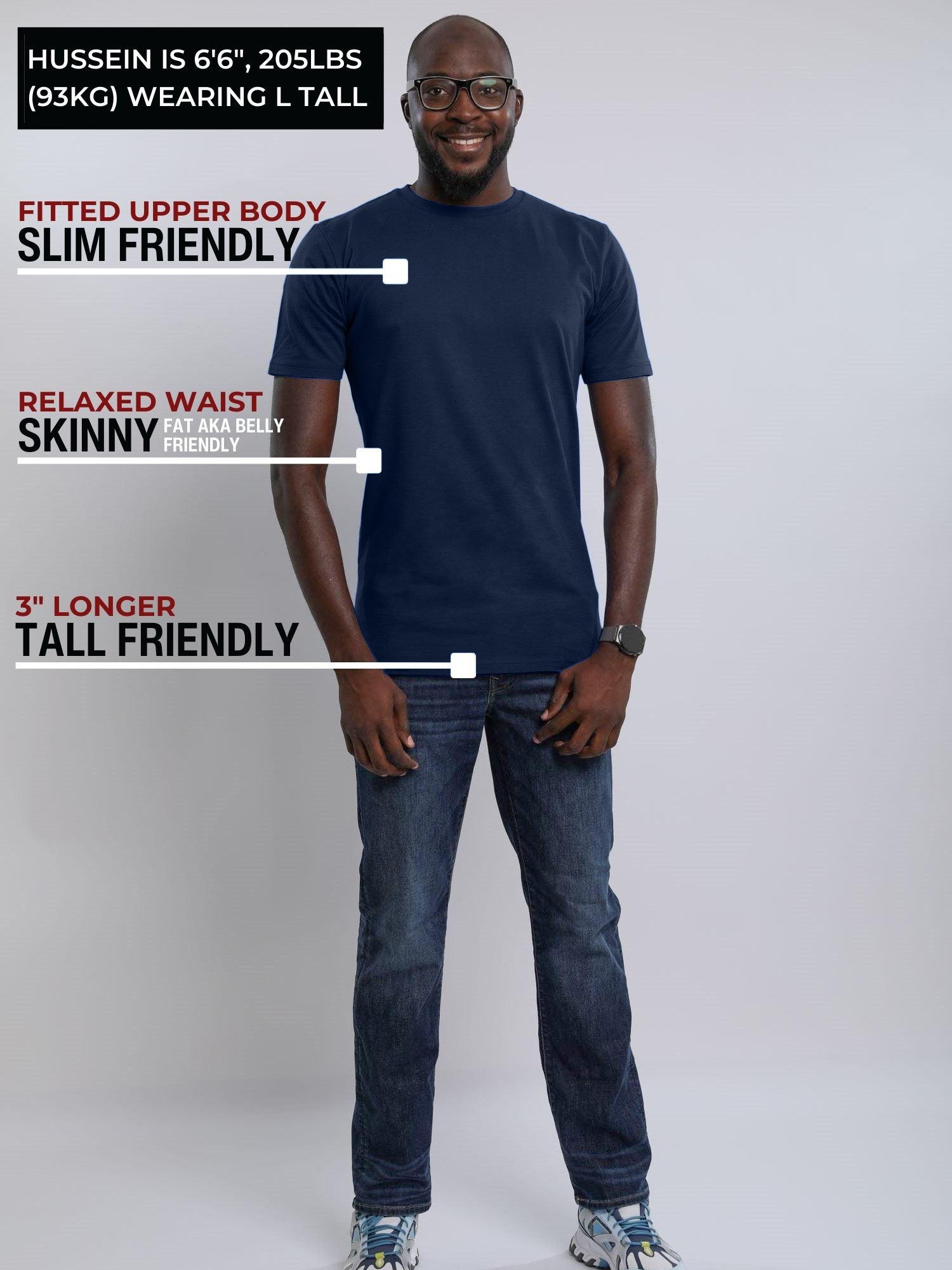 A head to toe shot of a tall slim guy wearing a large tall midnight blue heavyweight t-shirt.