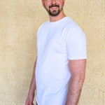 A tall slim man wearing an XL tall heavyweight white t-shirt.