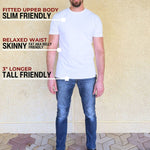 A head to toe shot of tall slim man wearing an XL tall heavyweight white t-shirt.